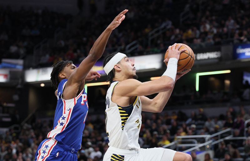 INDIANAPOLIS, INDIANA - JANUARY 25: Andrew Nembhard #2 of the Indiana Pacers shoots the ball while defended byTyrese Maxey #0 of the Philadelphia 76ers during the second half of the game at Gainbridge Fieldhouse on January 25, 2024 in Indianapolis, Indiana.    NOTE TO USER: User expressly acknowledges and agrees that, by downloading and or using this photograph, User is consenting to the terms and conditions of the Getty Images License Agreement.  (Photo by Andy Lyons/Getty Images)