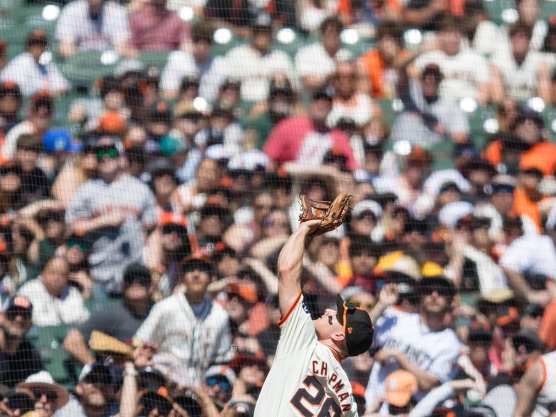 Apr 21, 2024; San Francisco, California, USA;  San Francisco Giants third baseman Matt Chapman (26) catches a foul ball against the Arizona Diamondbacks during the fourth inning at Oracle Park. Mandatory Credit: John Hefti-USA TODAY Sports