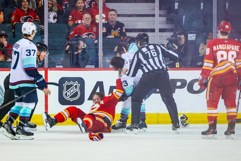 Mar 4, 2024; Calgary, Alberta, CAN; Calgary Flames center Blake Coleman (20) and Seattle Kraken left wing Brandon Tanev (13) fights during the third period at Scotiabank Saddledome. Mandatory Credit: Sergei Belski-USA TODAY Sports