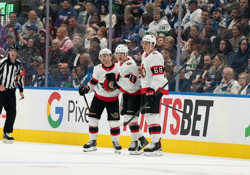 Sep 24, 2022; Toronto, Ontario, CAN; Ottawa Senators left wing Tim St  tzle (18) celebrates scoring a goal with Ottawa Senators defenseman Kristians Rubins (68) against the Toronto Maple Leafs during the first period at Scotiabank Arena. Mandatory Credit: Nick Turchiaro-USA TODAY Sports