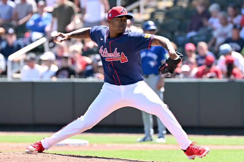 Mar 20, 2024; North Port, Florida, USA; Atlanta Braves starting pitcher Raisel Iglesias (26) throws a pitch in the first inning of a spring training game against the Toronto Blue Jays at CoolToday Park. Mandatory Credit: Jonathan Dyer-USA TODAY Sports