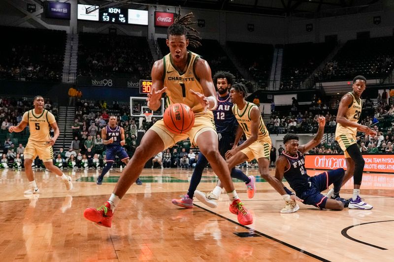 Jan 6, 2024; Charlotte, North Carolina, USA; Charlotte 49ers center Dishon Jackson (1) grabs the rebound against the Florida Atlantic Owls during the second half at Dale F. Halton Arena. Mandatory Credit: Jim Dedmon-USA TODAY Sports