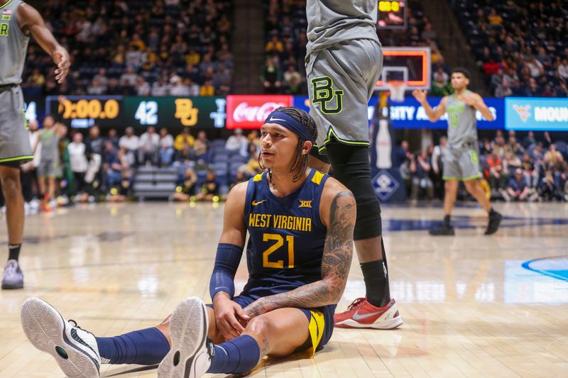 Feb 17, 2024; Morgantown, West Virginia, USA; West Virginia Mountaineers guard RaeQuan Battle (21) reacts at the end of the first half against the Baylor Bears at WVU Coliseum. Mandatory Credit: Ben Queen-USA TODAY Sports