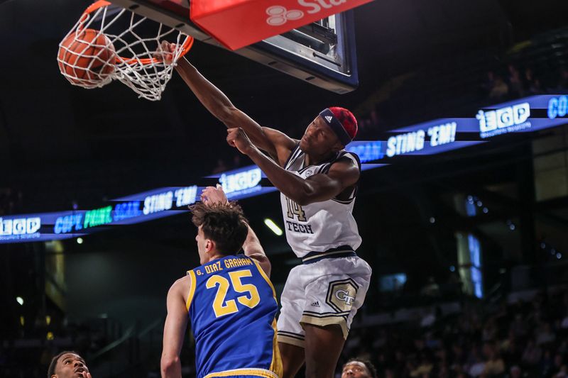 Jan 23, 2024; Atlanta, Georgia, USA; Georgia Tech Yellow Jackets guard Kowacie Reeves Jr. (14) dunks past Pittsburgh Panthers forward Guillermo Diaz Graham (25) in the second half at McCamish Pavilion. Mandatory Credit: Brett Davis-USA TODAY Sports
