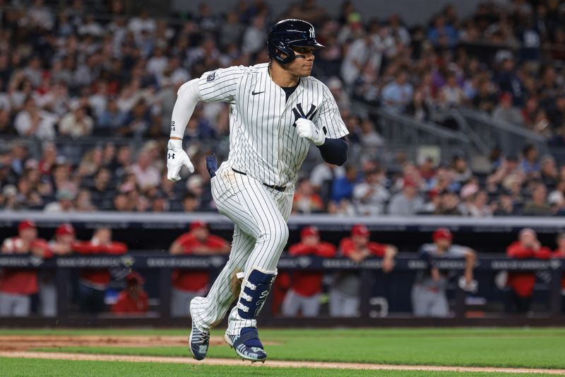 Aug 30, 2024; Bronx, New York, USA; New York Yankees right fielder Juan Soto (22) hits an RBI double during the third inning against the St. Louis Cardinals at Yankee Stadium. Mandatory Credit: Vincent Carchietta-USA TODAY Sports