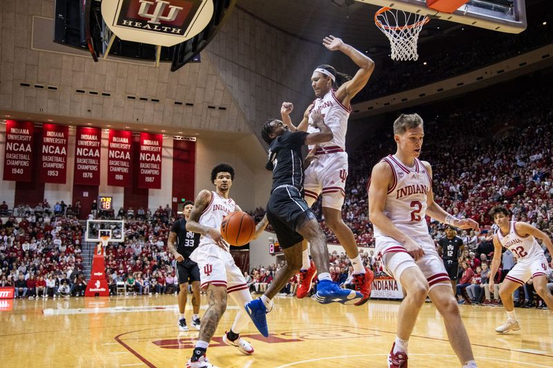 Dec 21, 2023; Bloomington, Indiana, USA;  North Alabama Lions guard Jacari Lane (5) loses the ball while Indiana Hoosiers forward Malik Reneau (5) defends in the second half at Simon Skjodt Assembly Hall. Mandatory Credit: Trevor Ruszkowski-USA TODAY Sports