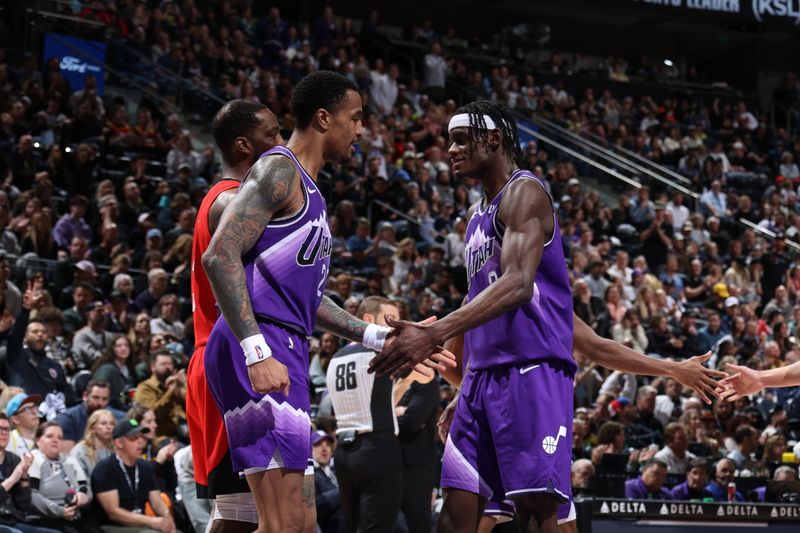 SALT LAKE CITY, UT - MARCH 29: John Collins #20 high fives Taylor Hendricks #0 of the Utah Jazz during the game against the Houston Rockets on March 29, 2024 at Delta Center in Salt Lake City, Utah. NOTE TO USER: User expressly acknowledges and agrees that, by downloading and or using this Photograph, User is consenting to the terms and conditions of the Getty Images License Agreement. Mandatory Copyright Notice: Copyright 2024 NBAE (Photo by Melissa Majchrzak/NBAE via Getty Images)