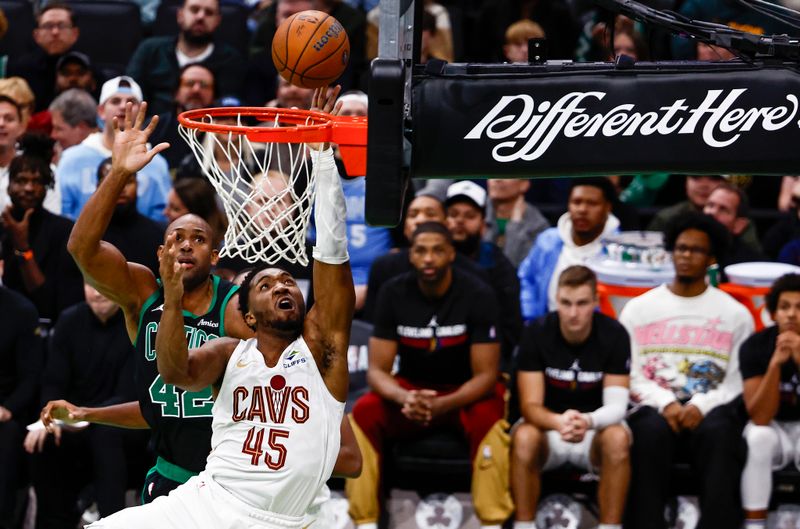 BOSTON, MASSACHUSETTS - NOVEMBER 19: Donovan Mitchell #45 of the Cleveland Cavaliers shoots against Al Horford #42 of the Boston Celtics during the fourth quarter of the Emirates NBA Cup at TD Garden on November 19, 2024 in Boston, Massachusetts. The Celtics won 120-117. NOTE TO USER: User expressly acknowledges and agrees that, by downloading and or using this photograph, User is consenting to the terms and conditions of the Getty Images License Agreement.  (Photo by Winslow Townson/Getty Images)