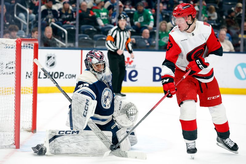 Mar 17, 2026; Columbus, Ohio, USA; Columbus Blue Jackets goalie Jet Greaves (73) makes a save on the deflected shot of Carolina Hurricanes right wing Jackson Blake (53) during the third period at Nationwide Arena. Mandatory Credit: Russell LaBounty-Imagn Images