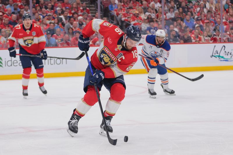 Jun 9, 2025; Sunrise, Florida, USA; Florida Panthers forward Aleksander Barkov (16) controls the puck during the third period against the Edmonton Oilers in game three of the 2025 Stanley Cup Final at Amerant Bank Arena. Mandatory Credit: Sam Navarro-Imagn Images