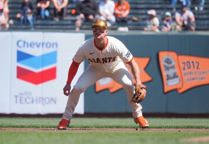 Apr 9, 2025; San Francisco, California, USA;  San Francisco Giants third baseman Matt Chapman (26) in position during the first inning against the Cincinnati Reds at Oracle Park. Mandatory Credit: Kelley L Cox-Imagn Images