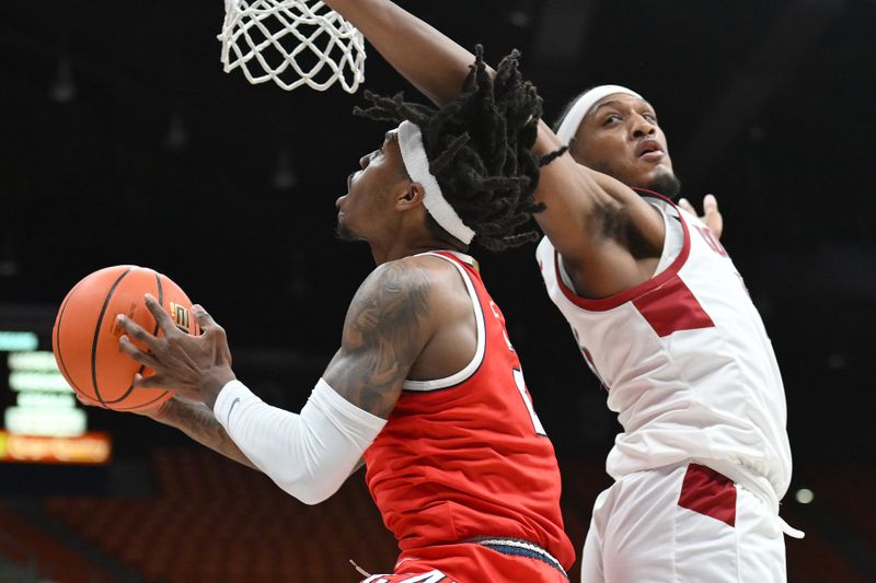 Jan 13, 2024; Pullman, Washington, USA; Arizona Wildcats guard Caleb Love (2) shoots the ball against Washington State Cougars forward Isaac Jones (13) in the second half at Friel Court at Beasley Coliseum. Washington State won 73-70. Mandatory Credit: James Snook-USA TODAY Sports