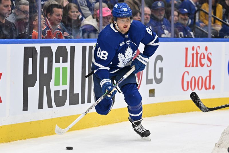 Mar 23, 2024; Toronto, Ontario, CAN; Toronto Maple Leafs forward William Nylander (88) skates with the puck against the Edmonton Oilers in the first period at Scotiabank Arena. Mandatory Credit: Dan Hamilton-USA TODAY Sports