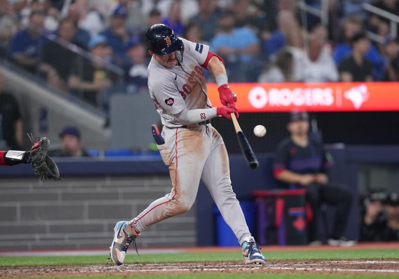 Jun 19, 2024; Toronto, Ontario, CAN; Boston Red Sox center fielder Romy Gonzalez (23) hits an RBI single against the Toronto Blue Jays during the sixth inning at Rogers Centre. Mandatory Credit: Nick Turchiaro-USA TODAY Sports