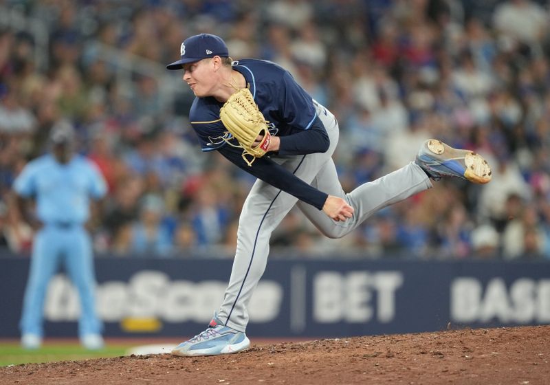 Jul 23, 2024; Toronto, Ontario, CAN; Tampa Bay Rays relief pitcher Pete Fairbanks (29) throws a pitch against the Toronto Blue Jays during the ninth inning at Rogers Centre. Mandatory Credit: Nick Turchiaro-USA TODAY Sports