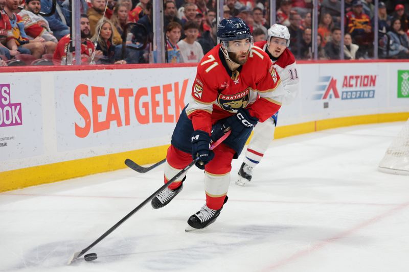Dec 30, 2025; Sunrise, Florida, USA; Montreal Canadiens center Jake Evans (71) moves the puck against the Montreal Canadiens during the second period at Amerant Bank Arena. Mandatory Credit: Sam Navarro-Imagn Images