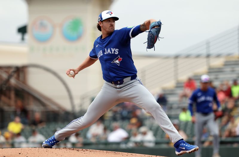 Mar 5, 2025; Bradenton, Florida, USA;  Toronto Blue Jays starting pitcher Kevin Gausman (34) throws a pitch during the first inning against the Pittsburgh Pirates at LECOM Park. Mandatory Credit: Kim Klement Neitzel-Imagn Images