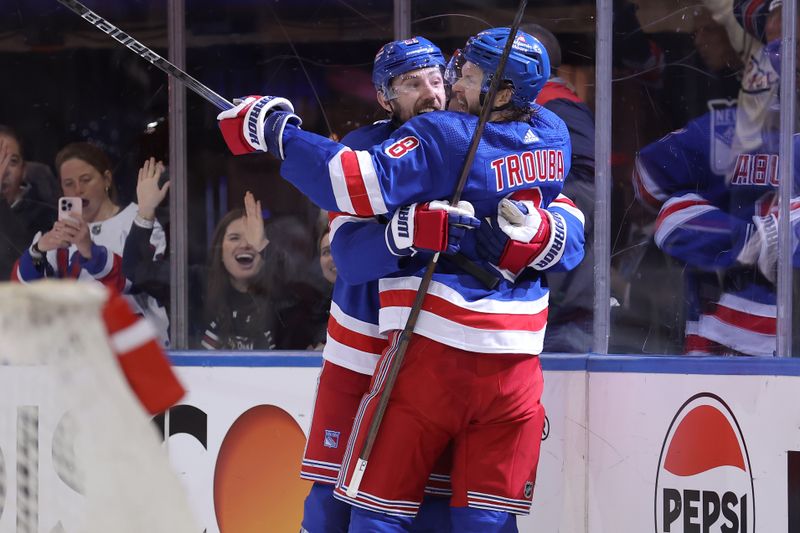 May 13, 2024; New York, New York, USA; New York Rangers defenseman Jacob Trouba (8) celebrates his short handed goal against the Carolina Hurricanes with center Barclay Goodrow (21) during the first period of game five of the second round of the 2024 Stanley Cup Playoffs at Madison Square Garden. Mandatory Credit: Brad Penner-USA TODAY Sports