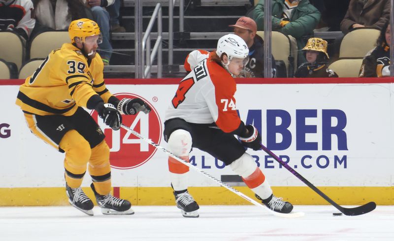 Jan 15, 2026; Pittsburgh, Pennsylvania, USA;  Philadelphia Flyers right wing Owen Tippett (74) moves the puck against Pittsburgh Penguins right wing Anthony Mantha (39) during the third period at PPG Paints Arena. Mandatory Credit: Charles LeClaire-Imagn Images