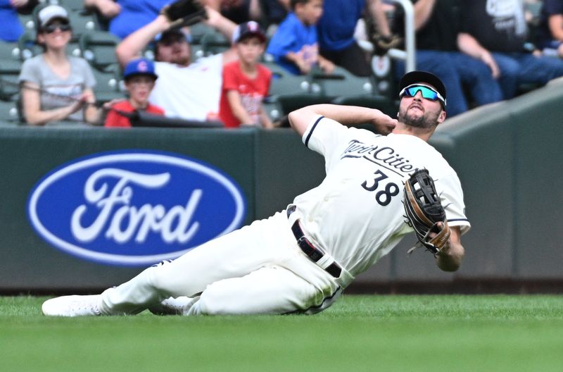 Sep 10, 2023; Minneapolis, Minnesota, USA; Minnesota Twins right fielder Matt Wallner (38) dove for the ball couldn t come up with the catch in the ninth inning against the New York Mets at Target Field. Mandatory Credit: Michael McLoone-USA TODAY Sports