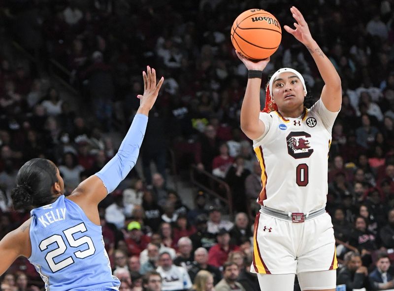 Mar 24, 2034; Columbia, So Carolina, USA;  South Carolina guard Te-Hina Paopao (0) makes a three-point shot near University of North Carolina guard Deja Kelly (25) during the second quarter of the second round NCAA Women's Basketball Tournament game at the Colonial Life Center.  Mandatory Credit: Ken Ruinard-USA TODAY Sports via Greenville News