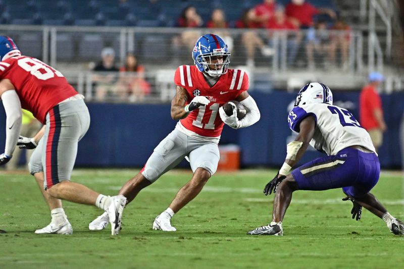 Sep 10, 2022; Oxford, Mississippi, USA; Ole Miss Rebels wide receiver Jordan Watkins (11) runs the ball against Central Arkansas Bears defensive back Tra Green (23) during the third quarter at Vaught-Hemingway Stadium. Mandatory Credit: Matt Bush-USA TODAY Sports