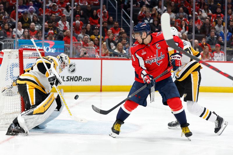 Apr 4, 2024; Washington, District of Columbia, USA; Pittsburgh Penguins goaltender Alex Nedeljkovic (39) makes a save in front of Washington Capitals left wing Alex Ovechkin (8) /in the third period at Capital One Arena. Mandatory Credit: Geoff Burke-USA TODAY Sports