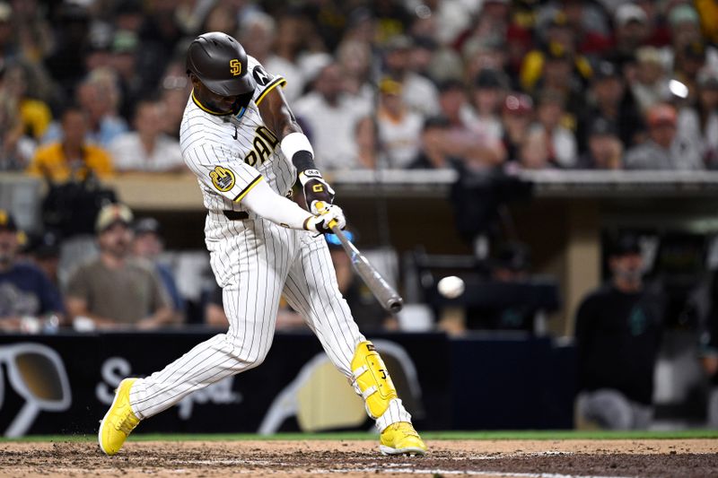 Jul 6, 2024; San Diego, California, USA; San Diego Padres left fielder Jurickson Profar (10) hits an RBI double against the Arizona Diamondbacks during the seventh inning at Petco Park. Mandatory Credit: Orlando Ramirez-USA TODAY Sports