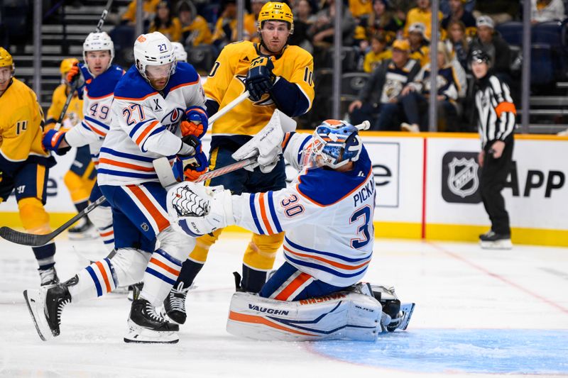 Oct 31, 2024; Nashville, Tennessee, USA;  Edmonton Oilers goaltender Calvin Pickard (30) blocks the shot of Nashville Predators center Colton Sissons (10) during the third period at Bridgestone Arena. Mandatory Credit: Steve Roberts-Imagn Images