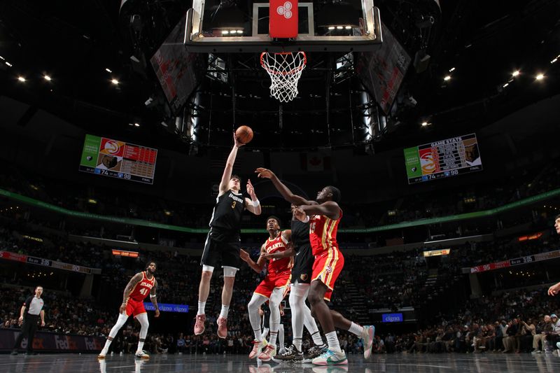 MEMPHIS, TN - MARCH 8: Jake LaRavia #3 of the Memphis Grizzlies drives to the basket during the game against the Atlanta Hawks on March 8, 2024 at FedExForum in Memphis, Tennessee. NOTE TO USER: User expressly acknowledges and agrees that, by downloading and or using this photograph, User is consenting to the terms and conditions of the Getty Images License Agreement. Mandatory Copyright Notice: Copyright 2024 NBAE (Photo by Joe Murphy/NBAE via Getty Images)