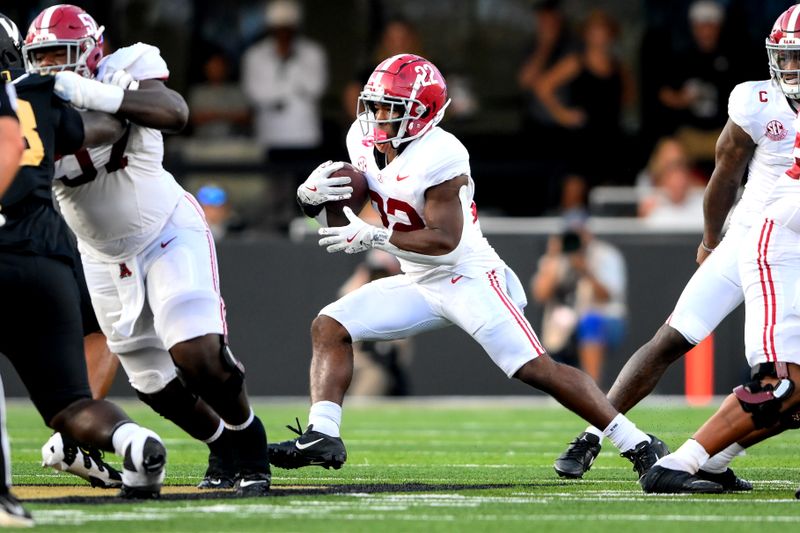 Oct 5, 2024; Nashville, Tennessee, USA;  Alabama Crimson Tide running back Justice Haynes (22) runs the ball against the Vanderbilt Commodores during the second half at FirstBank Stadium. Mandatory Credit: Steve Roberts-Imagn Images