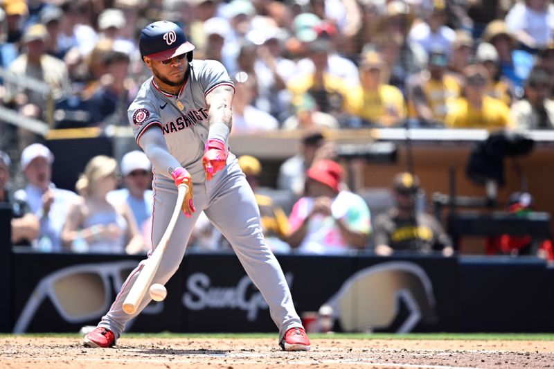 Jun 26, 2024; San Diego, California, USA; Washington Nationals designated hitter Harold Ramirez (43) tosses his bat at the ball during the fifth inning against the San Diego Padres at Petco Park. Mandatory Credit: Orlando Ramirez-USA TODAY Sports