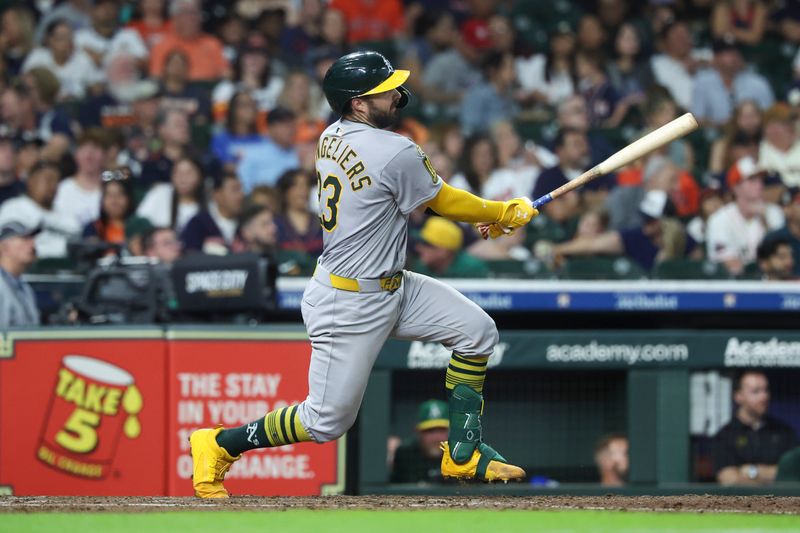 Jul 26, 2025; Houston, Texas, USA; Athletics catcher Shea Langeliers (23) hits a home run during the sixth inning against the Houston Astros at Daikin Park. Mandatory Credit: Troy Taormina-Imagn Images