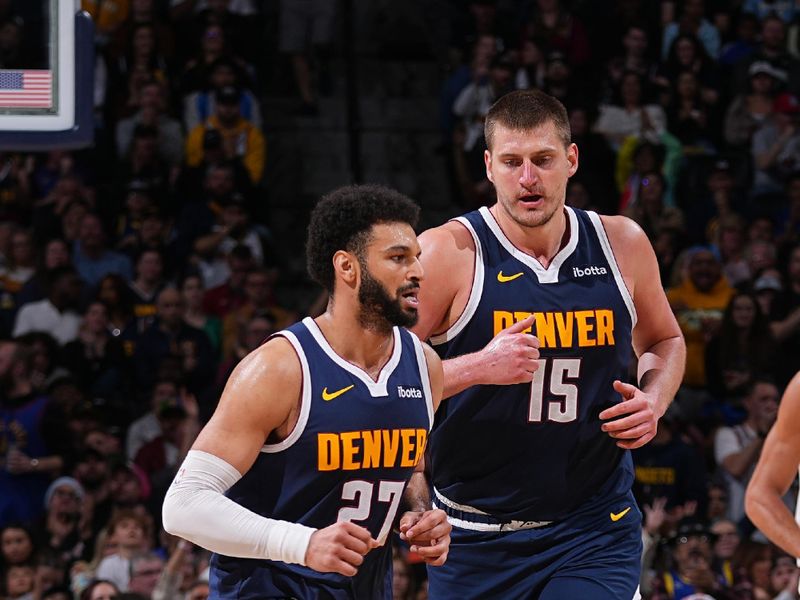 DENVER, CO - APRIL 10: Jamal Murray #27 of the Denver Nuggets and Nikola Jokic #15 look on during the game against the Minnesota Timberwolves on April 10, 2024 at the Ball Arena in Denver, Colorado. NOTE TO USER: User expressly acknowledges and agrees that, by downloading and/or using this Photograph, user is consenting to the terms and conditions of the Getty Images License Agreement. Mandatory Copyright Notice: Copyright 2024 NBAE (Photo by Bart Young/NBAE via Getty Images)