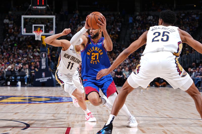 DENVER, CO - JANUARY 12: Jamal Murray #27 of the Denver Nuggets drives to the basket during the game against the New Orleans Pelicans on January 12, 2024 at the Ball Arena in Denver, Colorado. NOTE TO USER: User expressly acknowledges and agrees that, by downloading and/or using this Photograph, user is consenting to the terms and conditions of the Getty Images License Agreement. Mandatory Copyright Notice: Copyright 2024 NBAE (Photo by Garrett Ellwood/NBAE via Getty Images)