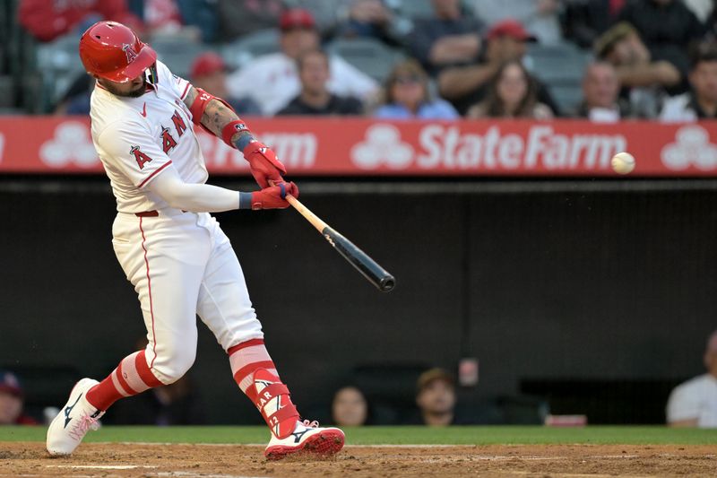 May 13, 2024; Anaheim, California, USA;   Los Angeles Angels right fielder Kevin Pillar (12) hits a three-run home run in the third inning against the St. Louis Cardinals at Angel Stadium. Mandatory Credit: Jayne Kamin-Oncea-USA TODAY Sports