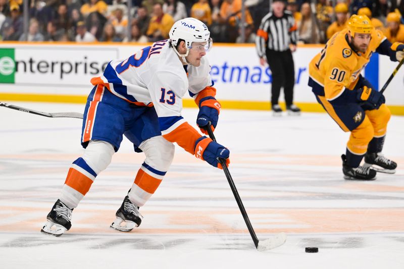 Jan 8, 2026; Nashville, Tennessee, USA; New York Islanders center Mathew Barzal (13) skates with the puck against the Nashville Predators during the second period at Bridgestone Arena. Mandatory Credit: Steve Roberts-Imagn Images