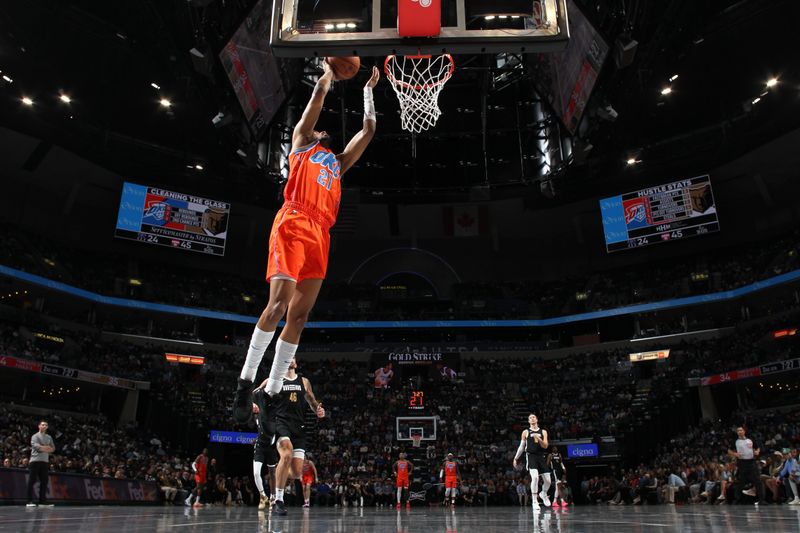 MEMPHIS, TN - MARCH 16: Aaron Wiggins #21 of the Oklahoma City Thunder drives to the basket during the game against the Memphis Grizzlies on March 16, 2024 at FedExForum in Memphis, Tennessee. NOTE TO USER: User expressly acknowledges and agrees that, by downloading and or using this photograph, User is consenting to the terms and conditions of the Getty Images License Agreement. Mandatory Copyright Notice: Copyright 2024 NBAE (Photo by Joe Murphy/NBAE via Getty Images)