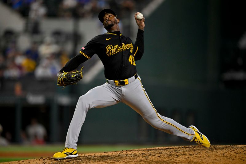 Aug 21, 2024; Arlington, Texas, USA; Pittsburgh Pirates relief pitcher Aroldis Chapman (45) pitches against the Texas Rangers during the eighth inning at Globe Life Field. Mandatory Credit: Jerome Miron-USA TODAY Sports