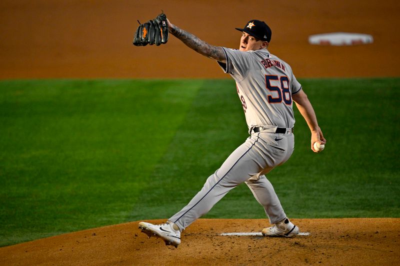 Aug 5, 2024; Arlington, Texas, USA; Houston Astros starting pitcher Hunter Brown (58) pitches against the Texas Rangers during the first inning at Globe Life Field. Mandatory Credit: Jerome Miron-USA TODAY Sports