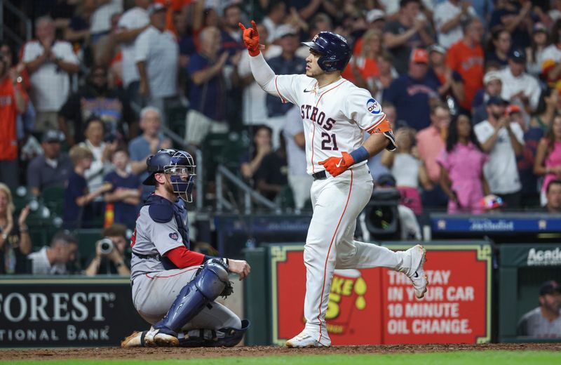 Aug 20, 2024; Houston, Texas, USA; Houston Astros catcher Yainer Diaz (21) scores a run after hitting a home run during the fifth inning against the Boston Red Sox at Minute Maid Park. Mandatory Credit: Troy Taormina-USA TODAY Sports