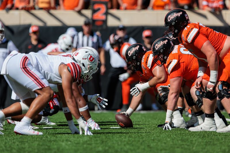 Sep 21, 2024; Stillwater, Oklahoma, USA; Oklahoma State Cowboys and Utah Utes line up during the first quarter at Boone Pickens Stadium. Mandatory Credit: William Purnell-Imagn Images