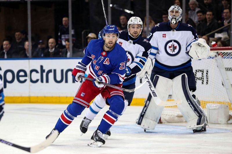 Mar 19, 2024; New York, New York, USA; New York Rangers center Barclay Goodrow (21) and Winnipeg Jets defenseman Neal Pionk (4) battle in front of Winnipeg Jets goalie Connor Hellebuyck (37) during the first period at Madison Square Garden. Mandatory Credit: Danny Wild-USA TODAY Sports