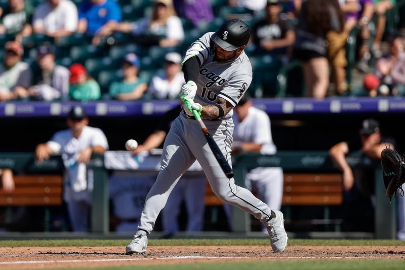 Aug 20, 2023; Denver, Colorado, USA; Chicago White Sox third baseman Yoan Moncada (10) hits a two RBI double to tie the game in the eighth inning against the Colorado Rockies at Coors Field. Mandatory Credit: Isaiah J. Downing-USA TODAY Sports