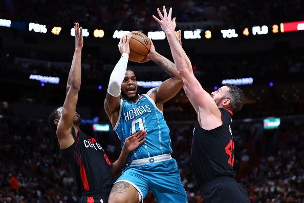 MIAMI, FLORIDA - DECEMBER 13: Miles Bridges #0 of the Charlotte Hornets drives to the basket during the third quarter of the game against the Miami Heat at Kaseya Center on December 13, 2023 in Miami, Florida. NOTE TO USER: User expressly acknowledges and agrees that, by downloading and or using this photograph, User is consenting to the terms and conditions of the Getty Images License Agreement. (Photo by Megan Briggs/Getty Images)