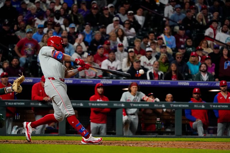 May 25, 2024; Denver, Colorado, USA;  Philadelphia Phillies first base Kody Clemens (2) breaks his bat on a ground-out double at Coors Field. Mandatory Credit: Michael Madrid-USA TODAY Sports