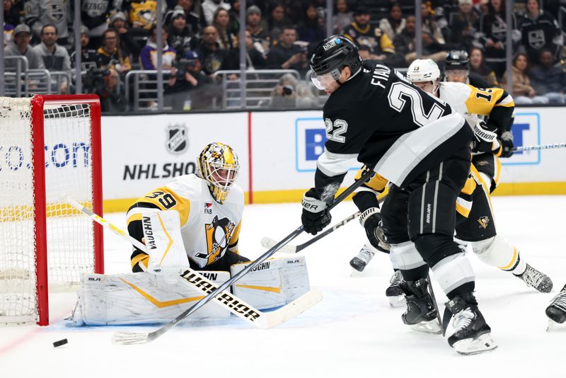 Jan 20, 2025; Los Angeles, California, USA;  Pittsburgh Penguins goaltender Alex Nedeljkovic (39) defends the goal as Los Angeles Kings left wing Kevin Fiala (22) shoots the puck during the second period at Crypto.com Arena. Mandatory Credit: Kiyoshi Mio-Imagn Images