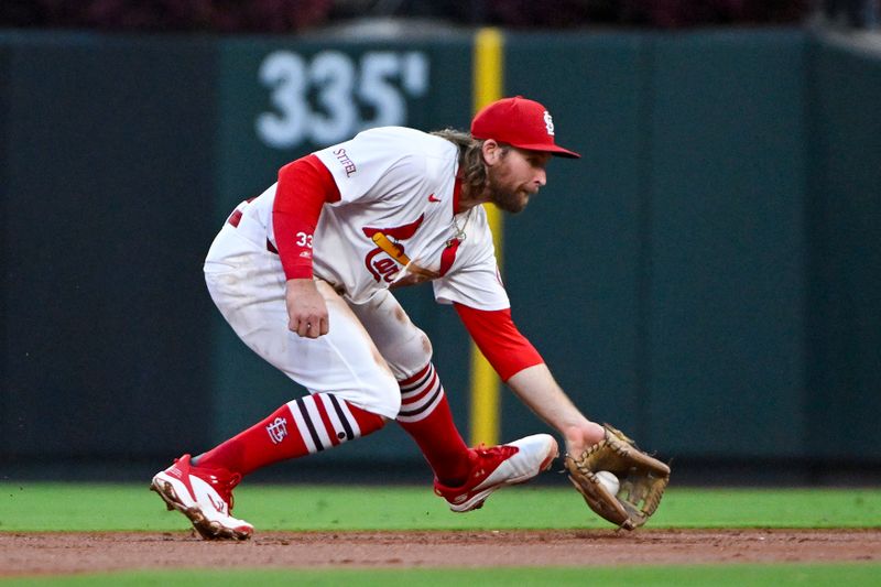 Sep 19, 2024; St. Louis, Missouri, USA;  St. Louis Cardinals second baseman Brendan Donovan (33) fields a ground ball against the Pittsburgh Pirates during the second inning at Busch Stadium. Mandatory Credit: Jeff Curry-Imagn Images