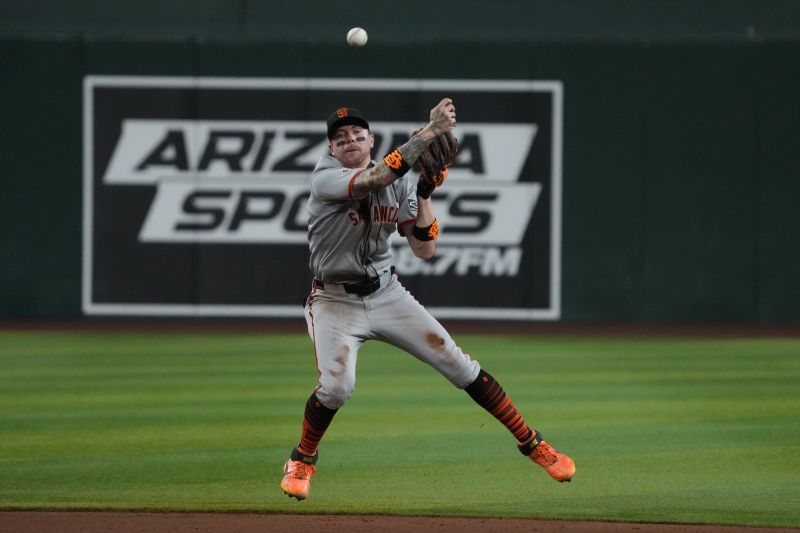 Sep 17, 2025; Phoenix, Arizona, USA; San Francisco Giants second base Christian Koss (50) makes the play for an out against the Arizona Diamondbacks in the eighth inning at Chase Field. Mandatory Credit: Rick Scuteri-Imagn Images