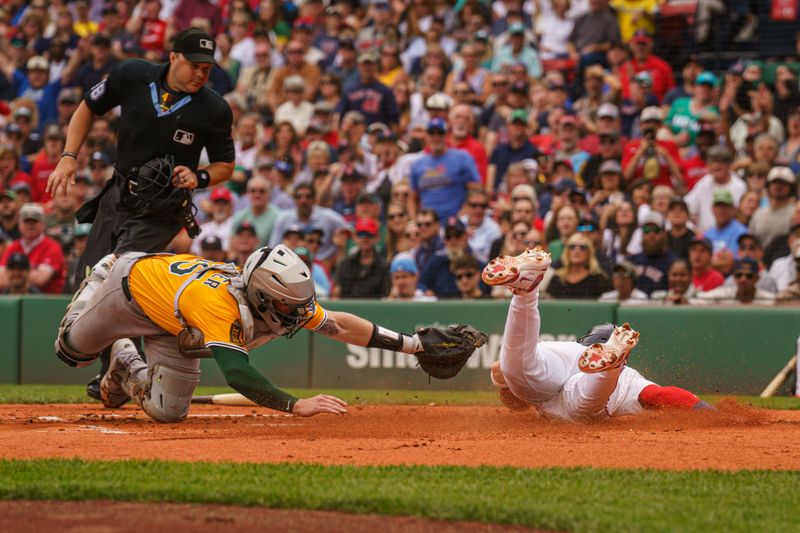Sep 18, 2025; Boston, Massachusetts, USA; Boston Red Sox shortstop Trevor Story (10) scores on a sacrifice out against Athletics catcher Willie MacIver (65) in the first inning at Fenway Park. Mandatory Credit: David Butler II-Imagn Images